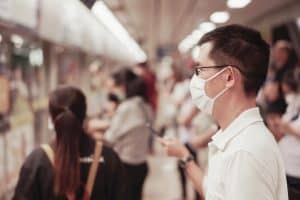 man wearing mask in commute