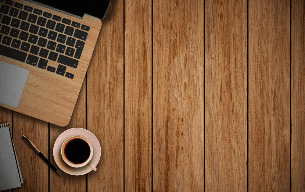 Coffee and a laptop on a table