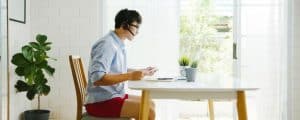 man dressed formally working from home