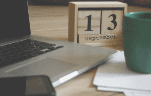 Desk calendar and laptop
