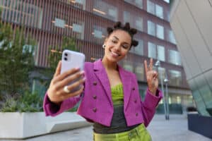 influencer taking a selfie in a city landscape