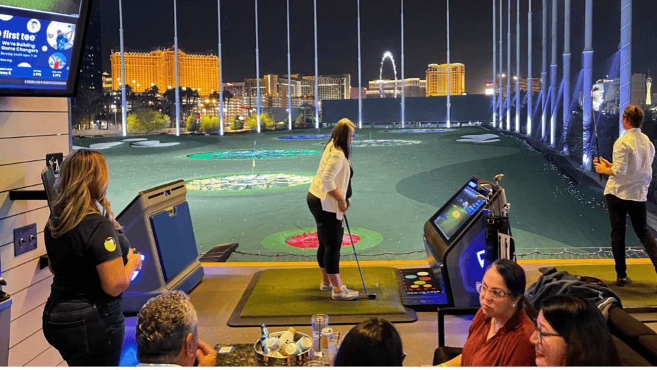 People playing golf at an event